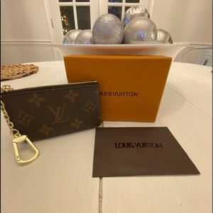 LV key pouch w box and dust bag.